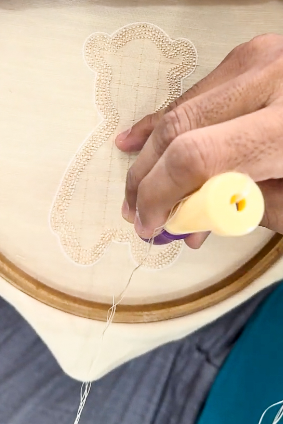 Arya Giri karighar crafting a teddy motif with punch needle embroidery | Arya Giri's karighars 